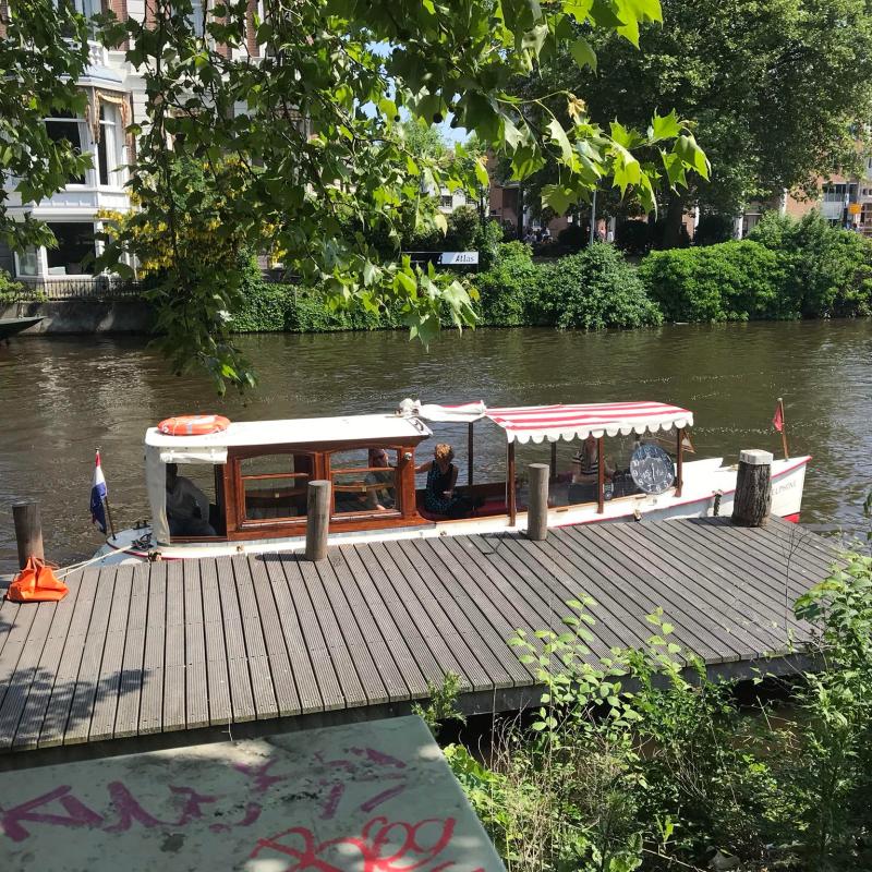 The private boat at a dock near the Rijskmuseum