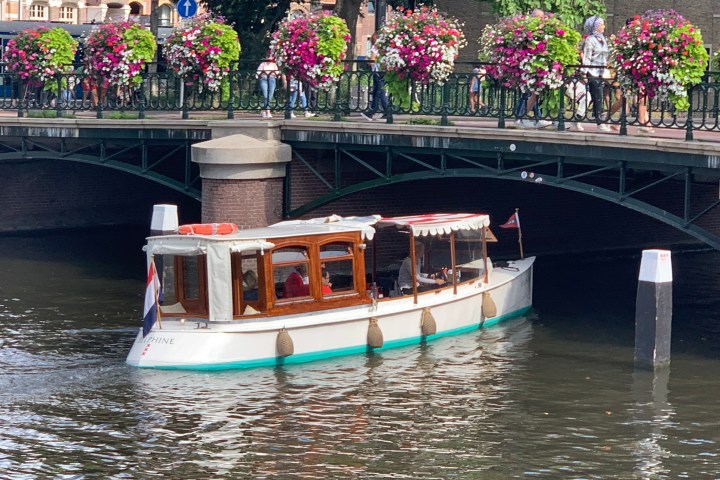 Private boat Delphine on the canals of Amsterdam