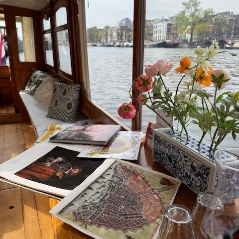 Historic boat tour with guide on charming boat