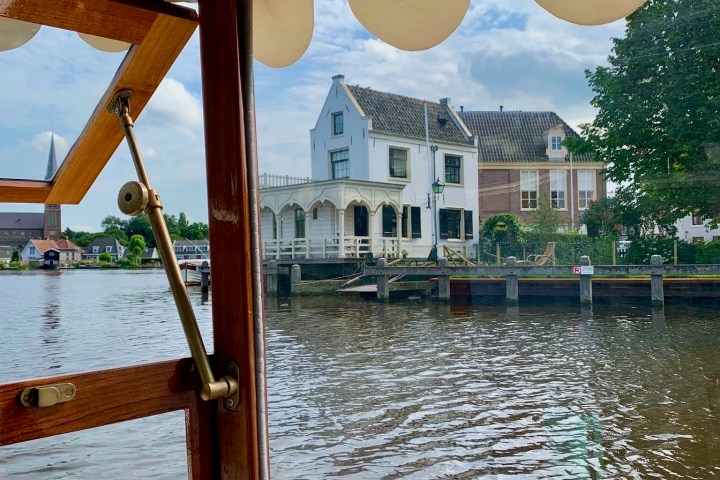 a wooden boat in a body of water