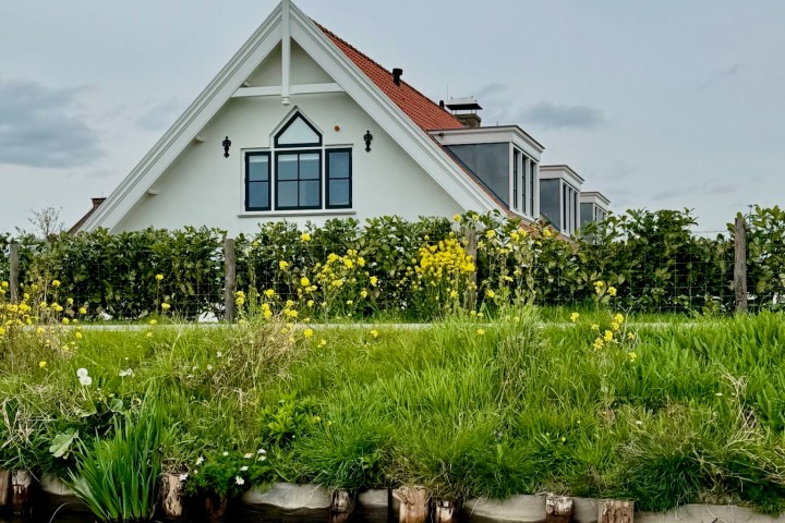 a small house in a body of water